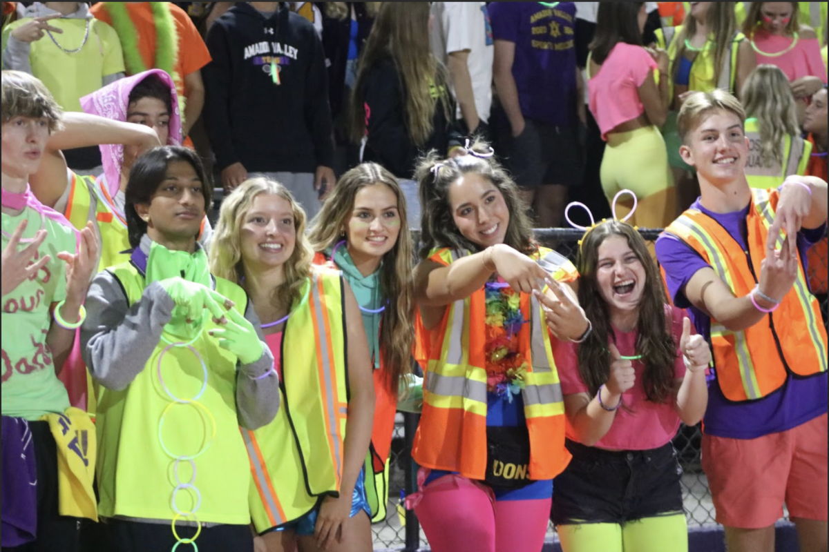 The Don Squad pose for a photo, decked out in neon to showcase their school spirit for their last game.